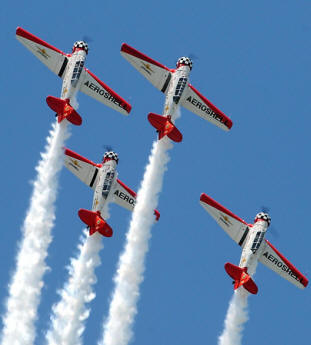 The Aeroshell Aerobatic Team performs for the crowd Saturday.